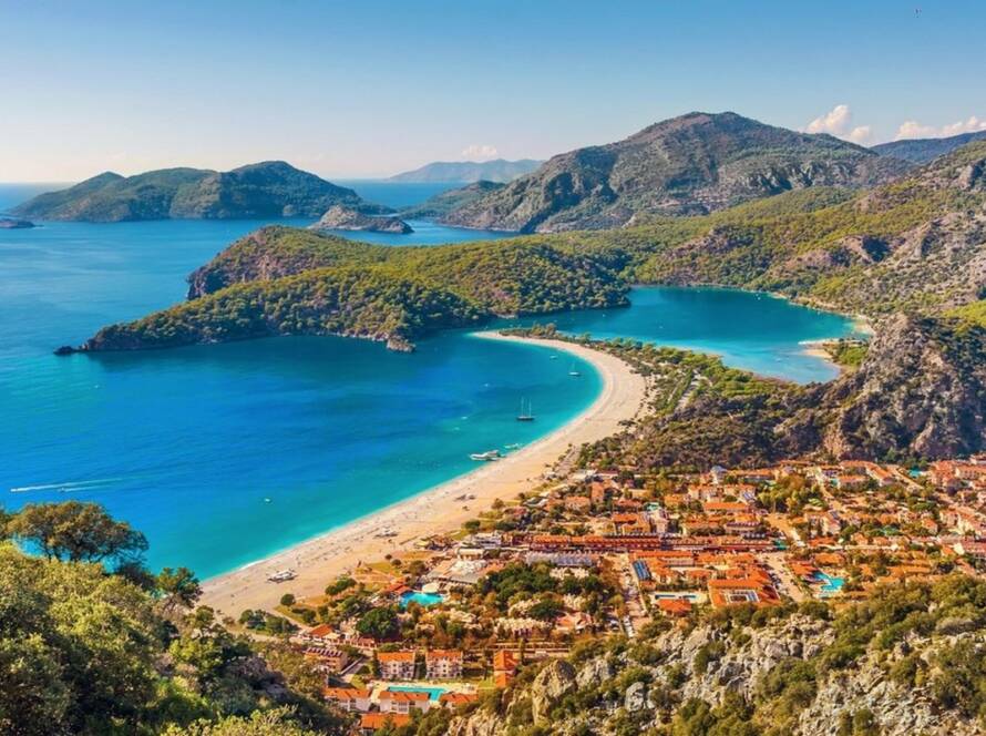 Turquoise paradise: Gulet sails Oludeniz Blue Lagoon, Turkey.