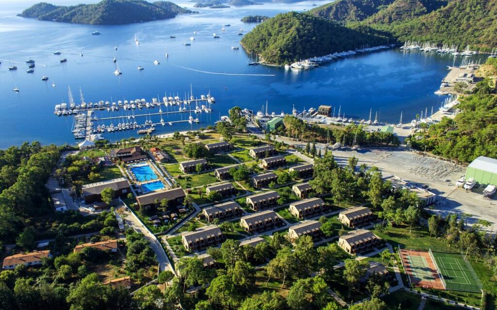 Gocek, Turkey: Tranquil harbor lined with luxury gulets, ready to embark on turquoise adventures.