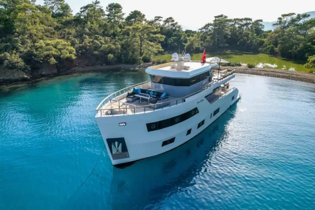 Modern Trawler Cinar Yildizi glides through the crystal-clear waters of Gocek, Turkey