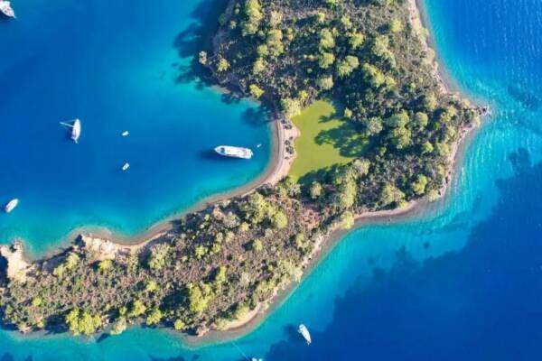 Turquoise paradise beckons: Gocek's secluded bays meet your luxury yacht - ultimate privacy, crystal waters. Charter adventure awaits.