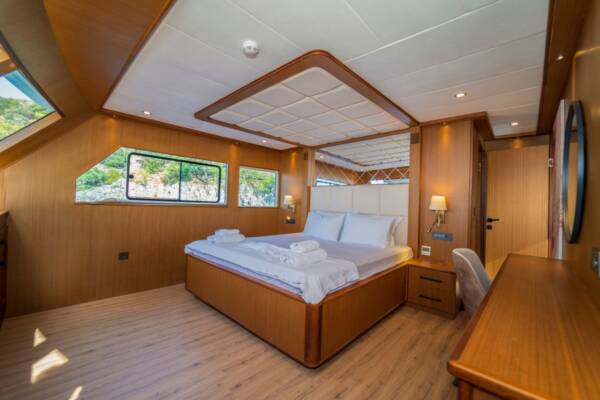 Unwind in unparalleled luxury in the Alegria Trawler Yacht's spacious and opulent master cabin.
