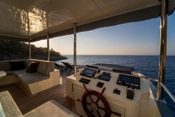 Take the helm in style at the Alegria Trawler Yacht's modern steering station in Gocek, offering panoramic views and intuitive controls.