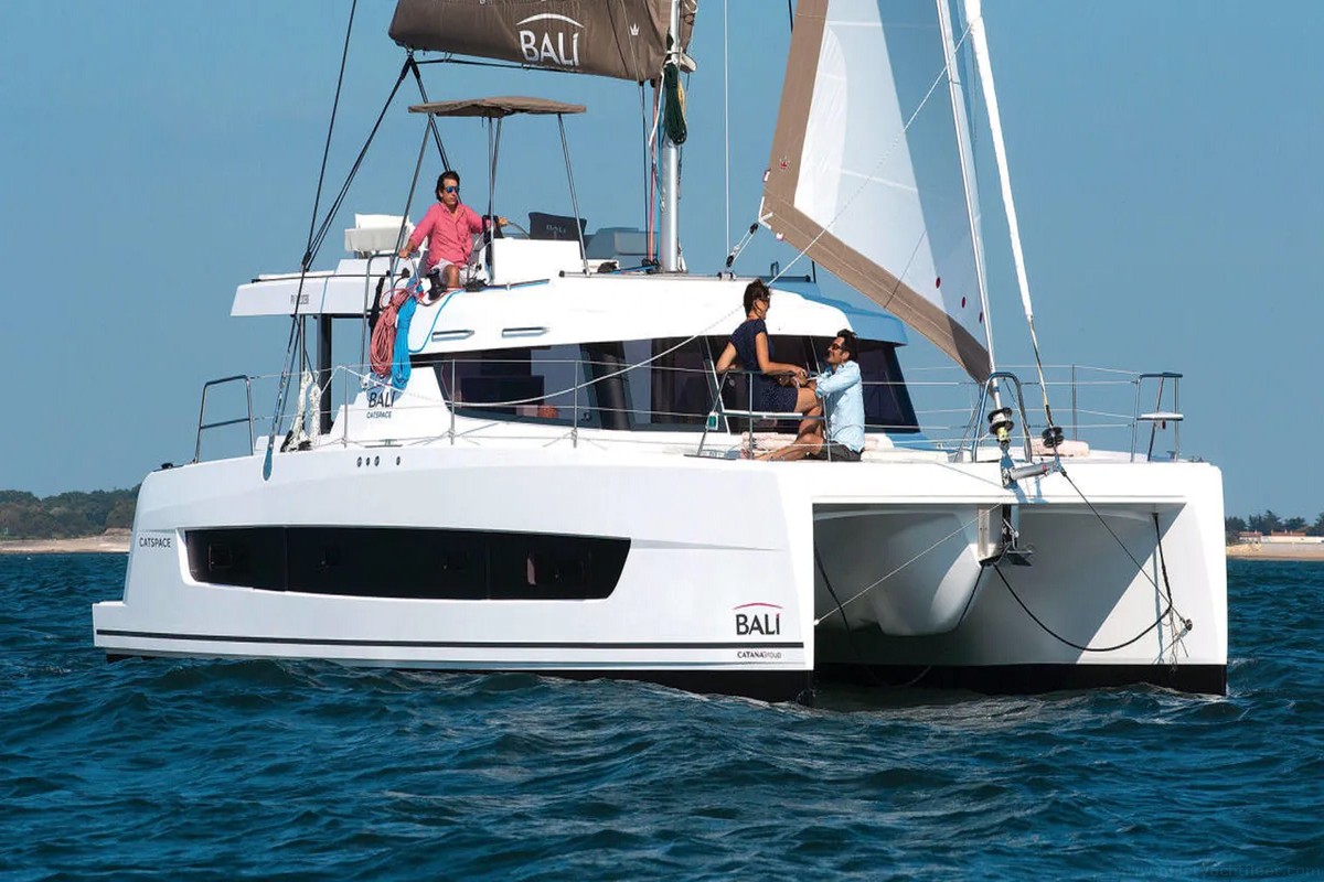 Bali Catspace - Moana 2 catamaran docked in Fethiye Port, offering luxury sailing with 4 cabins, a flybridge, and modern amenities.